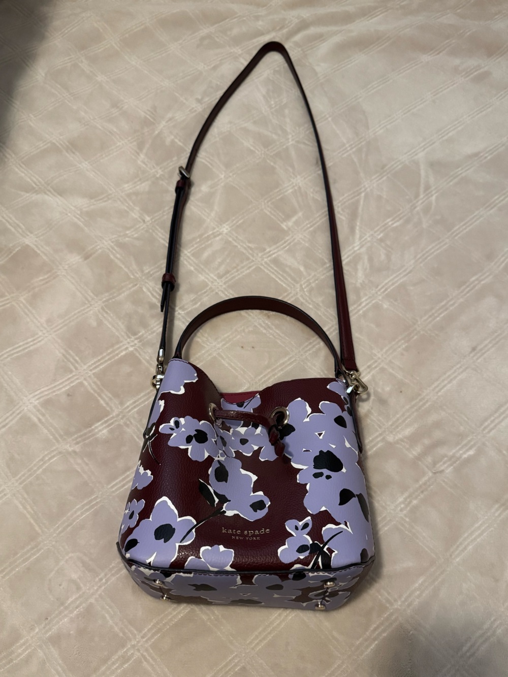 kate spade burgundy leather bucket bag with lilac floral print